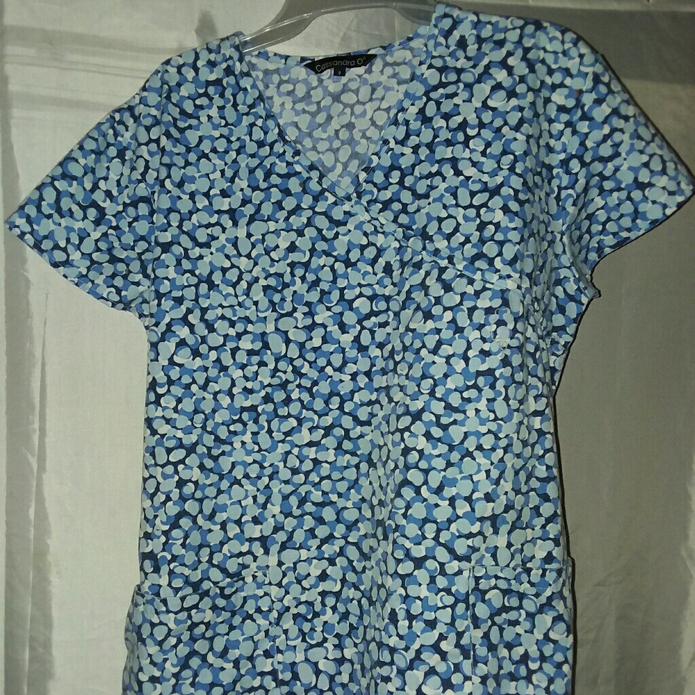 6- Scrub Tops  1-scrub vest 1- capri scrub bottoms